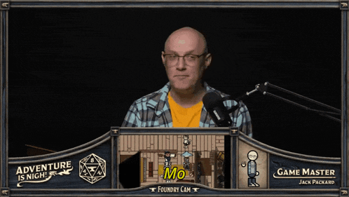 a man speaking into a microphone with the words motherfucker on the screen behind him