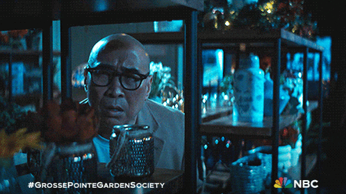 an advertisement for grosse pointe garden society shows a bald man with glasses