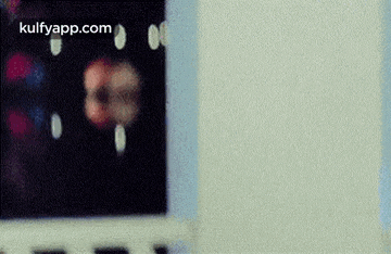 a close up of a laptop screen with a blurred image of a person .