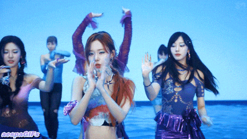a group of women are dancing in front of a blue background that says ncspngifs