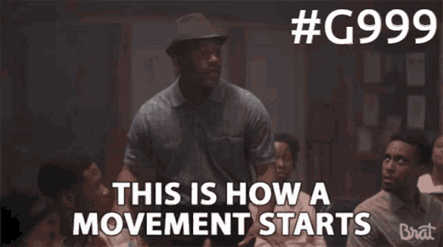 a man in a hat is standing in front of a group of people and says this is how a movement starts
