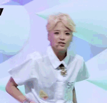 a person wearing a white shirt with the word see on the front