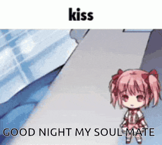 a girl with pink hair is standing next to a bed .