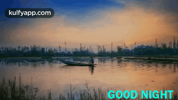 a man in a boat on a lake with the words good night written on it