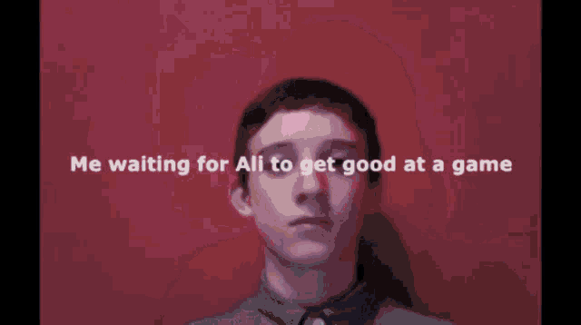 a blurry picture of a man with the words " me waiting for ali to get good at a game "