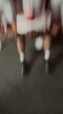 a blurry picture of a person rollerblading on a road