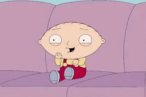 stewie from family guy is sitting on a purple couch making a funny face .