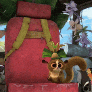 a cartoon squirrel wearing a hat is sitting next to a red bag