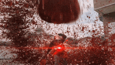 a man in a black shirt is surrounded by a red light