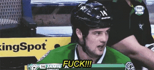 a hockey player wearing a helmet that says 14 on it