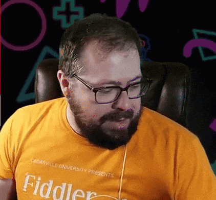 a man with a beard and glasses wears a yellow fiddler shirt