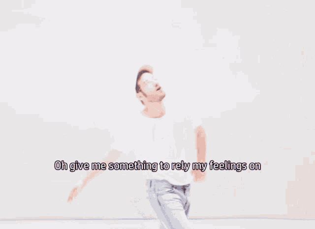 a man in a white shirt says oh give me something to rely my feelings
