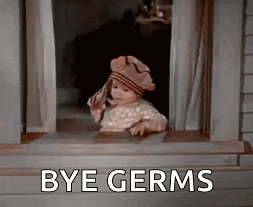 a little girl is looking out of a window with the words `` bye germs '' written on it .