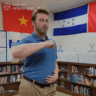 a man in a blue shirt is standing in front of a flag that says made with reface app on it