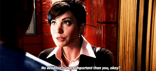 a woman is talking to a man and says " no deadline is more important than you okay ? "