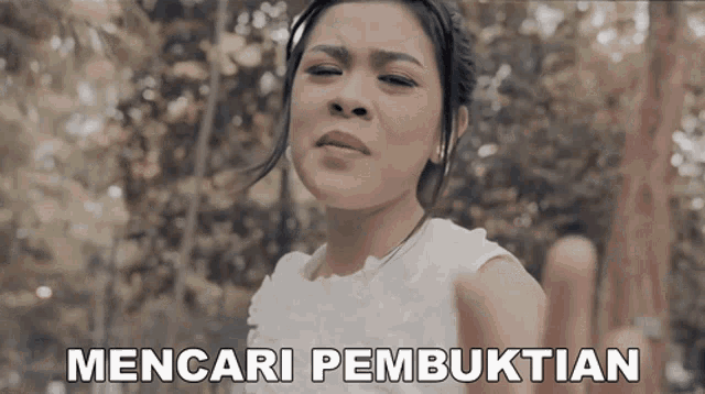 a woman in a white dress with the words mencari pembuktian written below her