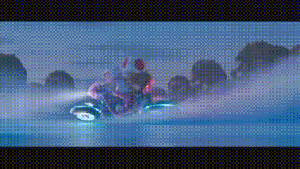 a person is riding a motorcycle on a snowy surface .