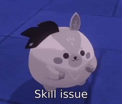a stuffed animal with a black bow on its head is standing on a blue floor .