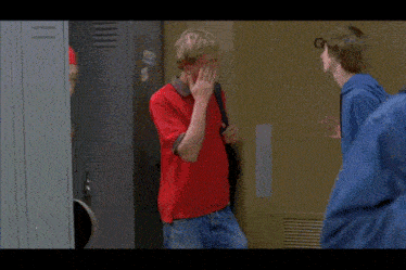 a man in a red shirt is standing in front of a sign that says gpt-5 on it