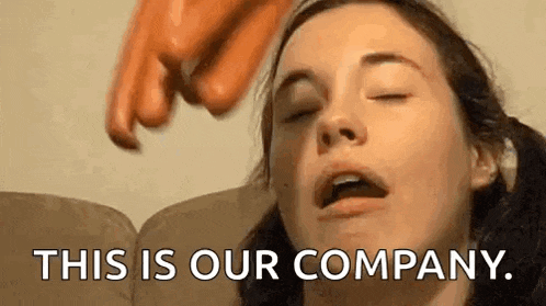 a woman is sitting on a couch with her eyes closed and a person is pointing at her face .
