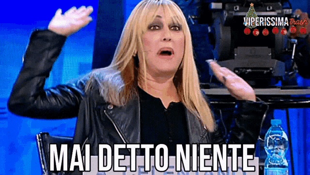 a woman in a black leather jacket says mai detto niente
