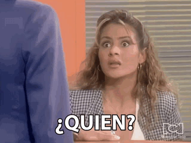 a woman in a plaid jacket says quien