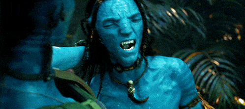 a blue avatar with dreadlocks and a necklace screams