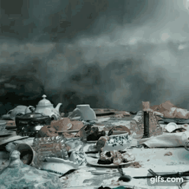 a table with a lot of food on it and smoke coming out of it
