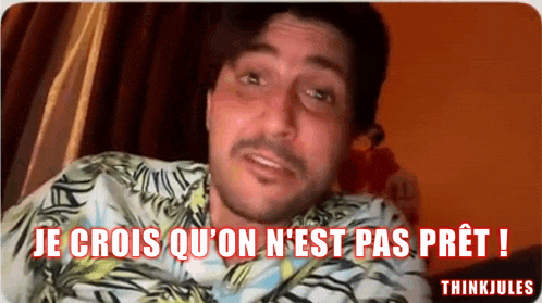 a man in a hawaiian shirt says je crois qu ' on n ' est pas pret !