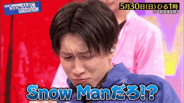 a man with snow man written on his chest