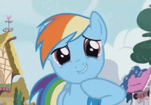 a cartoon pony with a rainbow mane and tail is smiling and looking at the camera .