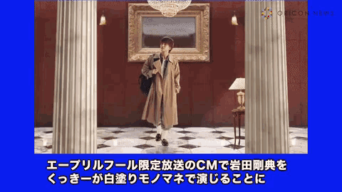 a man in a trench coat is in a room with columns and a picture on the wall