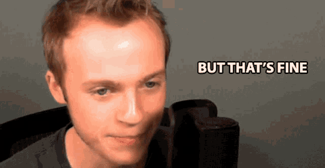 a man sitting in front of a microphone with the words but that 's fine below him