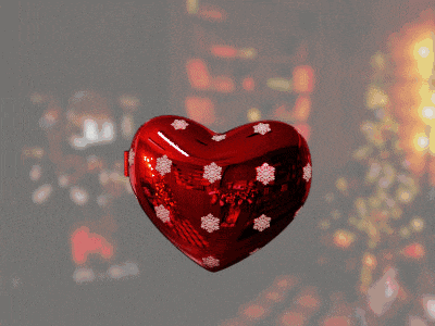 a heart shaped christmas ornament with a picture of a girl and the words " i love you " on it