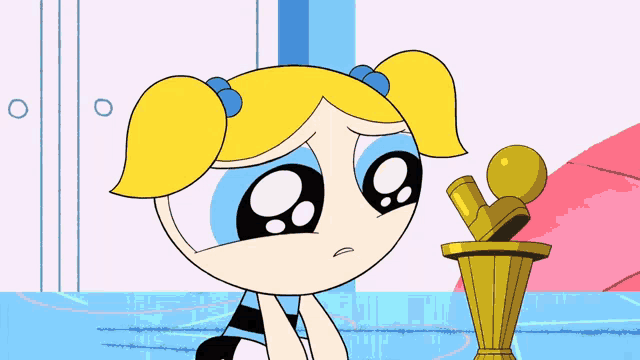 bubbles from the powerpuff girls is crying and looking at a trophy