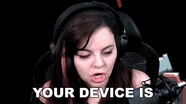 a woman in headphones says ready to go in front of a microphone