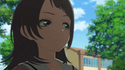 a close up of a girl 's face with green eyes