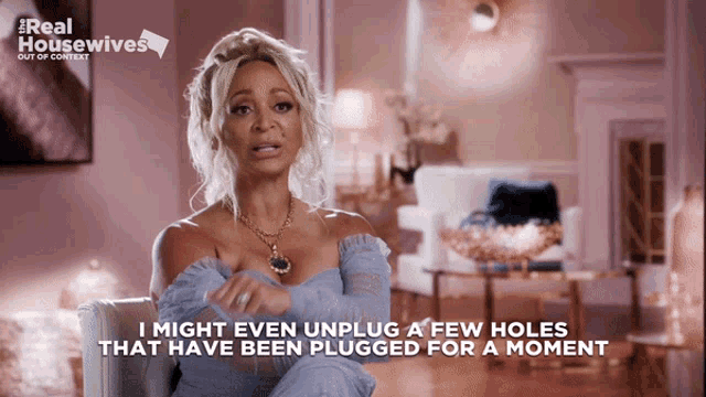 a woman is sitting in a chair with the words i might even unplug a few holes that have been plugged