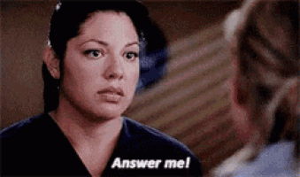 a woman in a scrub top is talking to another woman and says `` answer me ! ''