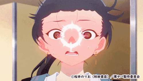 a close up of a girl 's face with a circle in her eye