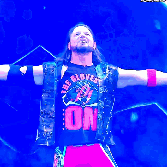 a wrestler is wearing a shirt that says the gloves are on