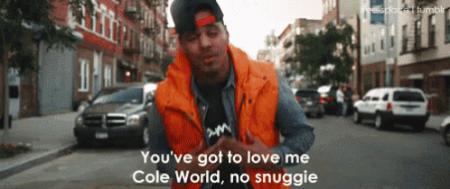 a man in an orange vest says you 've got to love me cole world no snuggie