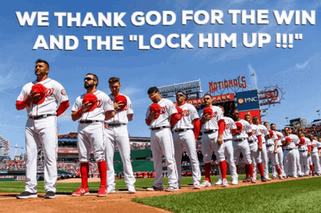 washington nationals baseball players stand on the field in front of a nationals stadium