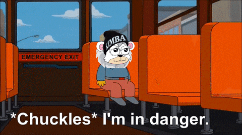 a cartoon bear wearing a kimba hat is sitting in an orange seat