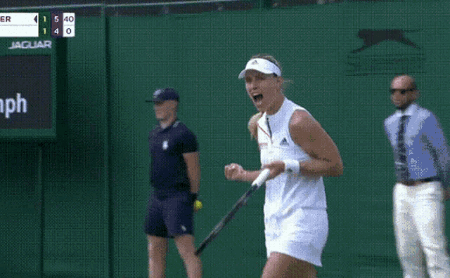 a woman is holding a tennis racquet in front of a scoreboard which says 89 mph