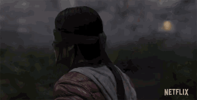 a woman wearing a blindfold and a netflix logo in the corner