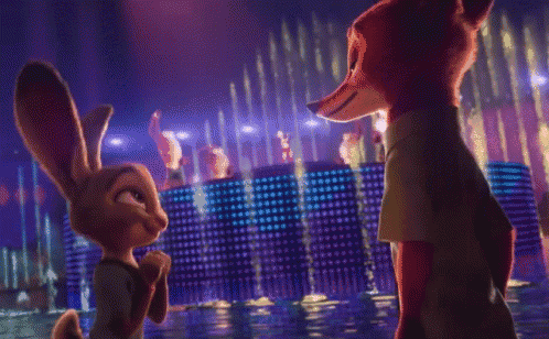 a fox and a rabbit look at each other in front of a fountain