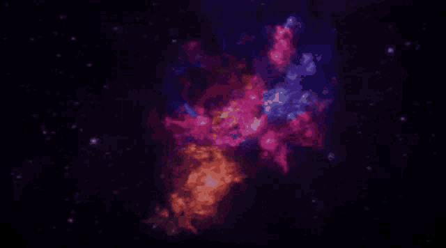 a colorful nebula in the middle of a dark space