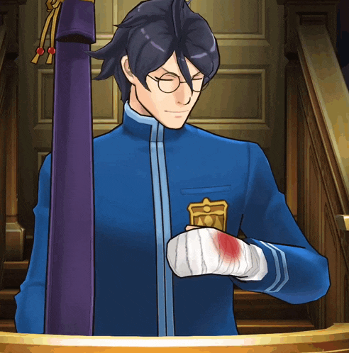 a man in a blue uniform with a gold emblem on his chest