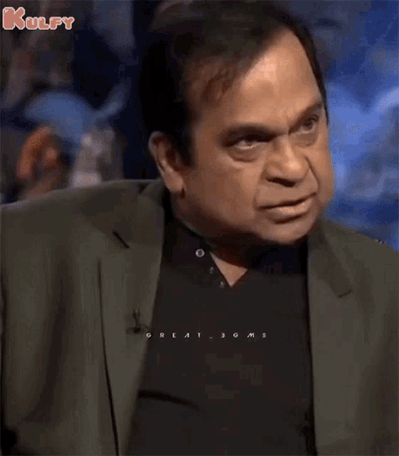 a man wearing a black shirt with the word great on it